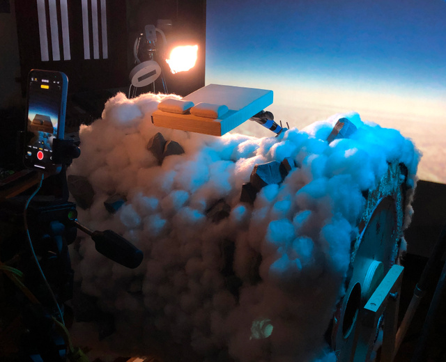 a model Earthfoam mattress floating above clouds